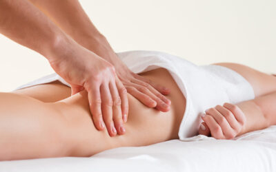 Detail of hands massaging human calf muscle. Detail of hands massaging human calf muscle.Therapist applying pressure on female leg.